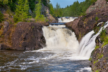 Beautiful landscape with wood and a falls.