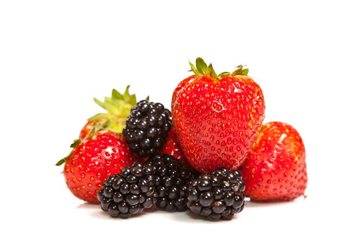 Composition of ripe black and red raspberries and strawberries
