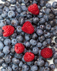 Composition of ripe black and red raspberries, strawberries and
