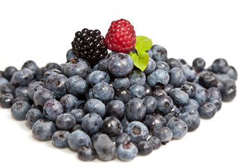 Composition of ripe black and red raspberries, strawberries and