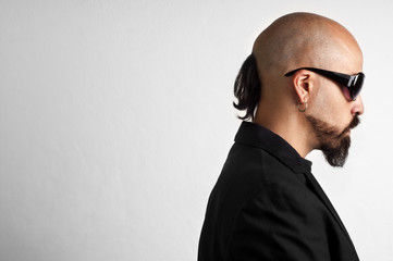 blacks man with glasses, beard and black jacket