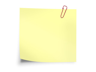 Yellow sticky post it note with paperclip