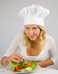 a young cook garnished salad