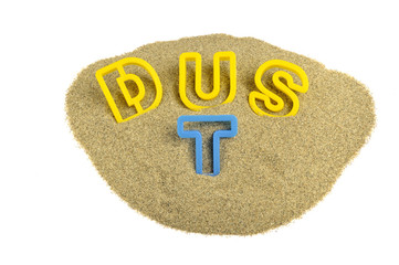 dust written on sand with colored letters