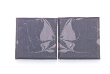 Isolated handmade soap with butterfly pattern