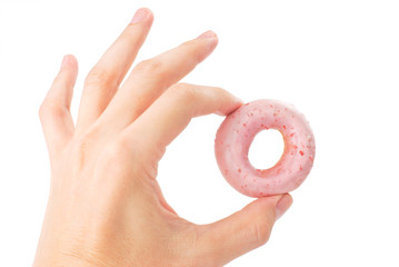 Lovely mini donut in man's hand