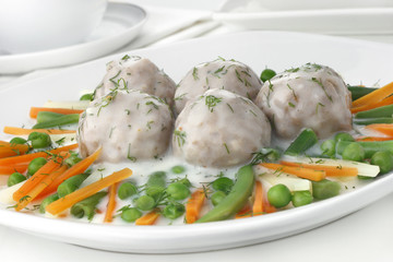 Pork meatballs with dill sauce and vegetables