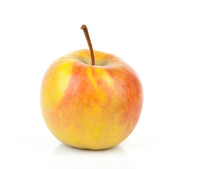 one yellow with red apple over white background
