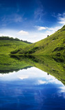 Green hill reflection