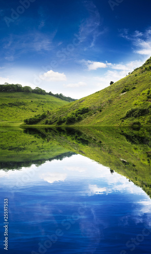 Green hill reflection