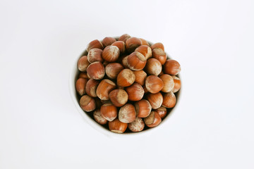 a bowl full of hazelnuts