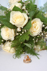 wedding rings and bouquet