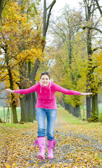 woman in autumnal alley