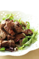 Japanese cube steak with baby leaf salad