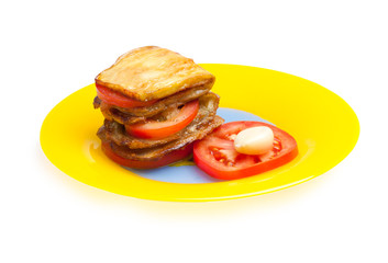 Dish of eggplant, tomatoes and garlic.