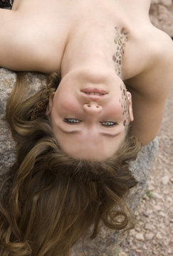 Girl lying on a rock