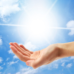 Planet Earth and human hand