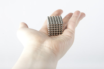 Cube assembled from metallic magnetic segments
