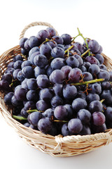 Fototapeta premium black grapes in the basket