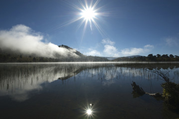 reflected in the lake