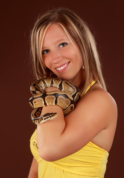 woman holding a snake