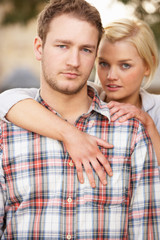 Portrait Of Romantic Young Couple Embracing