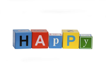 happy written using wooden blocks