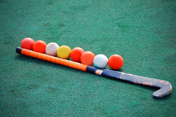Field hockey stick with many balls - obrazy, fototapety, plakaty