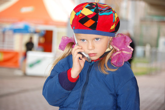 Little girl talking on the phone