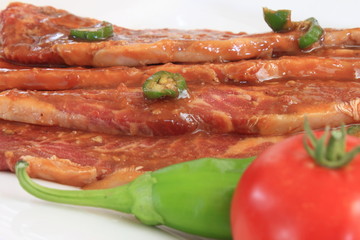 Korean short ribs with Tomato and pepper garnish