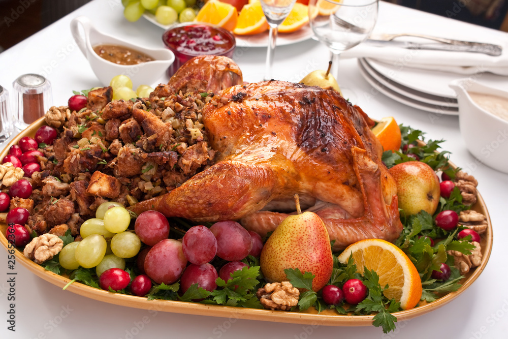 Wall mural roasted holiday turkey garnished with fruit and salad