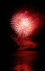 Colorful fireworks with water reflection