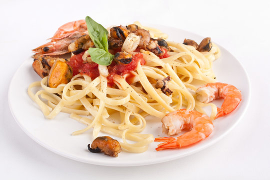 serving of pasta with marinara sauce and seafood
