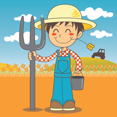 Farmer boy working on the farm, holding a fork and a bucket
