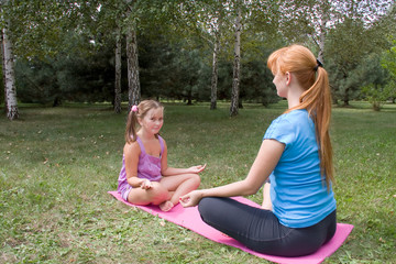 Mother and daughter engage in fitness