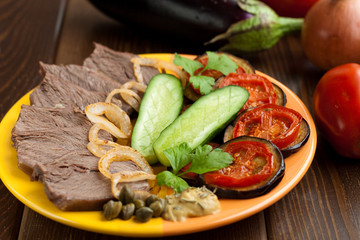 Cold meat with eggplants, tomatoes, cucumbers and onion