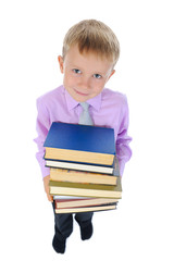 boy holds a stack of books