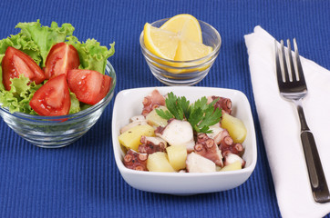 Octopus with potatoes and mixed salad