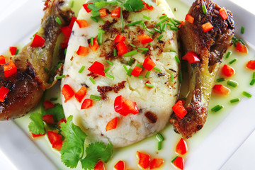 chicken drumsticks served with mash