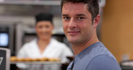 Handsome male customer in a bakery