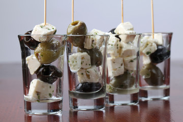 Greek appetizers with black and green olives and feta cheese