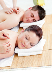 Obraz na płótnie Canvas Positive young couple receiving a back massage
