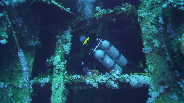 Technical divers exploring shipwreck aida