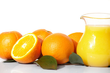 Naklejka na ściany i meble Orange juice and oranges on a white background.