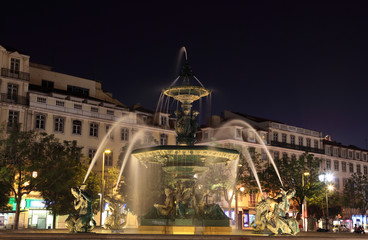 Fototapeta na wymiar Fountain at Rossio Square in Lisbon, Portugal