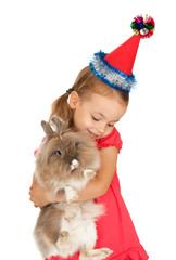 Child in the New Year hat with a rabbit.