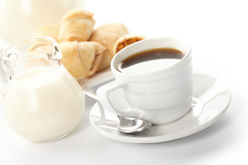 Cup of coffee with a roll