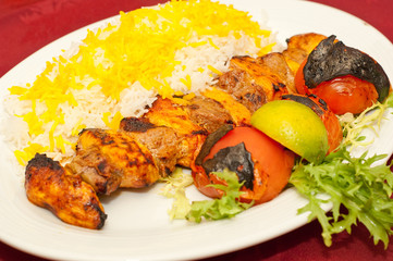 middle eastern mixed grill meal with rice, chicken and lamb