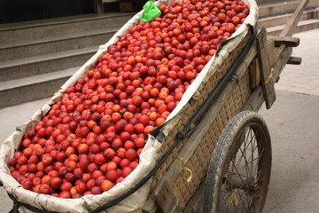 Hand cart full of plums
