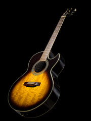 Acoustic  guitar over black background